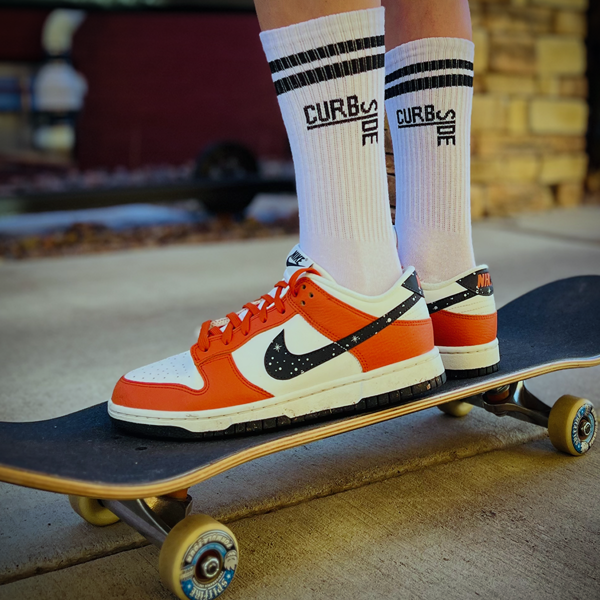 Curbside Classic crew socks with nike sneakers standing on a skateboard