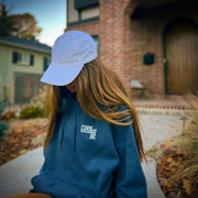 Cute teen girl wearing Curbside Urban Navy Hoodie with logo on front